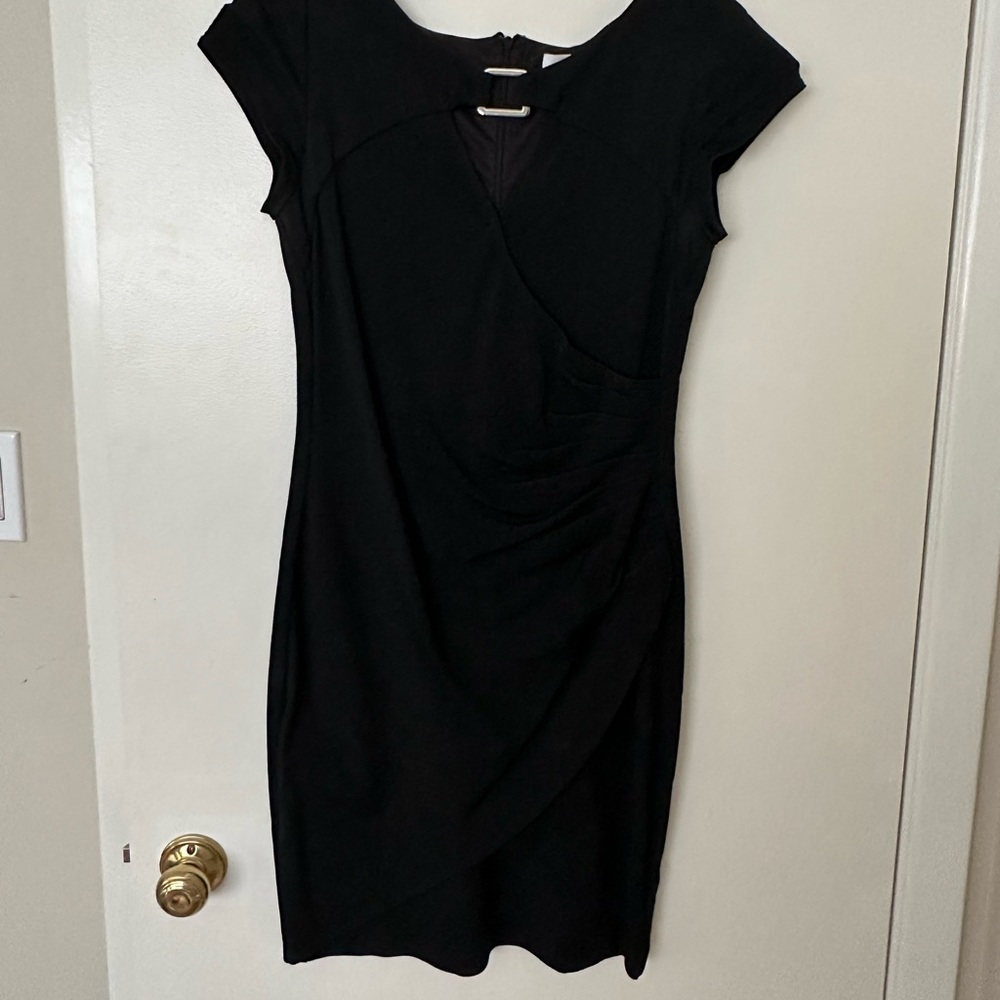 Black dress with small cutout on front and silver detailing by cache